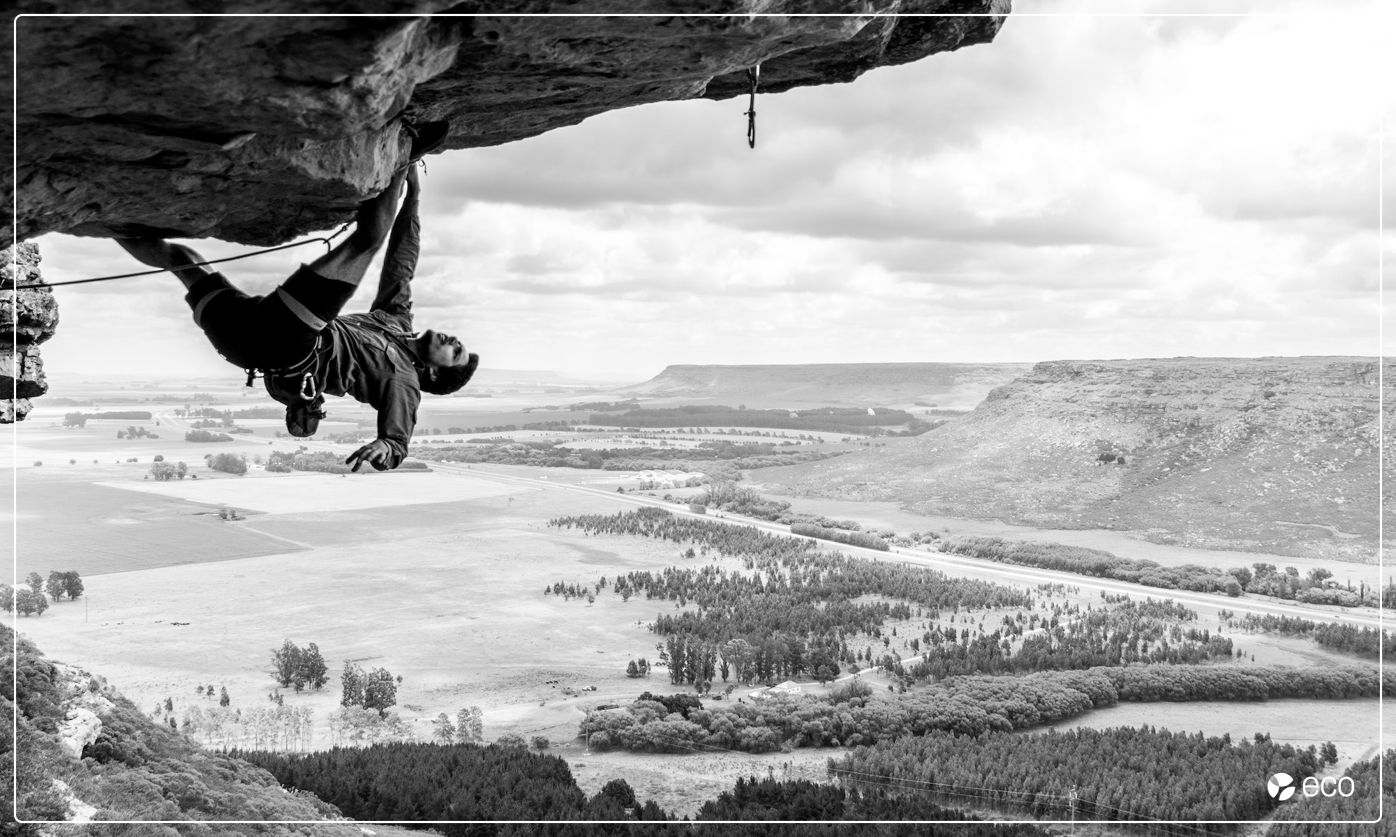 Man rock climbing upside-down
