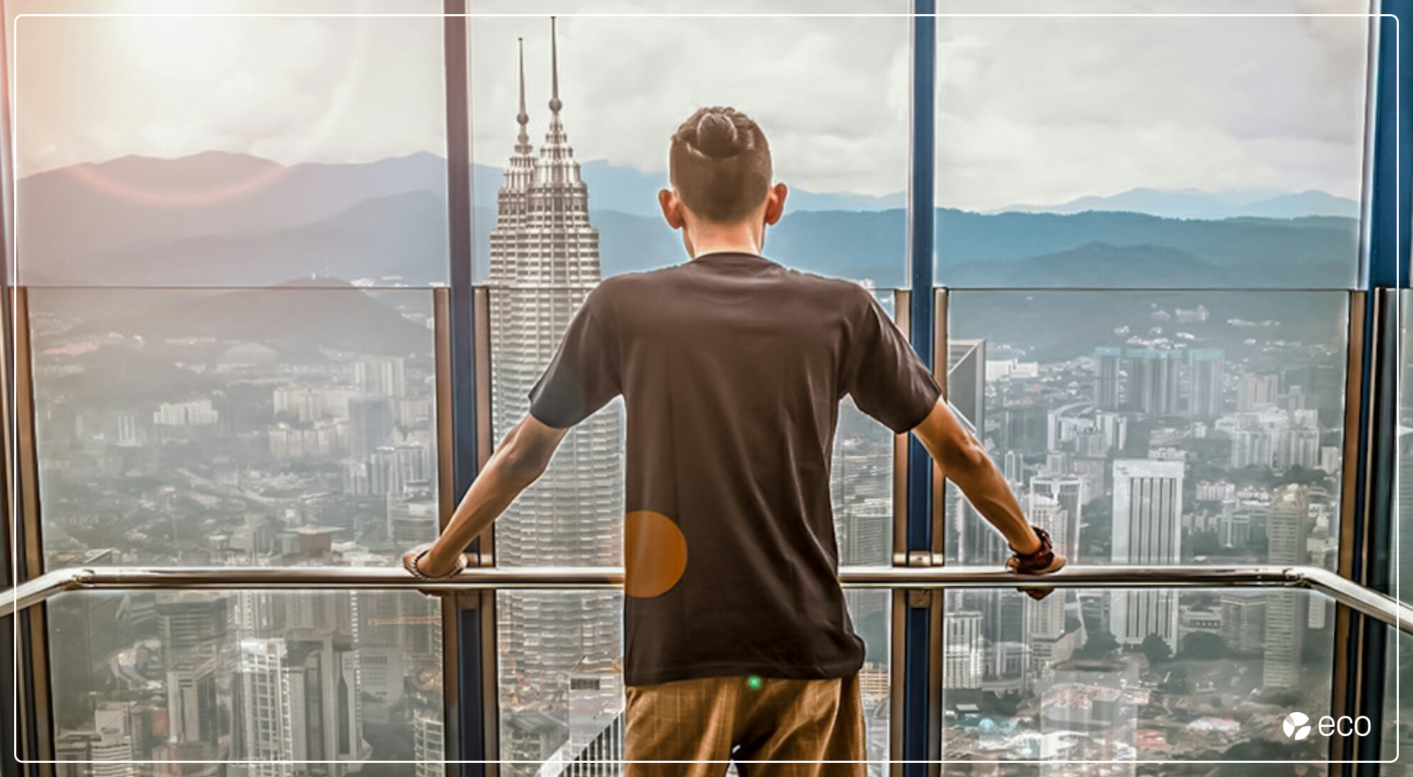 Man overlooking city from office building